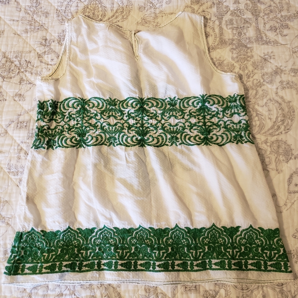 Green and white sleeveless blouse